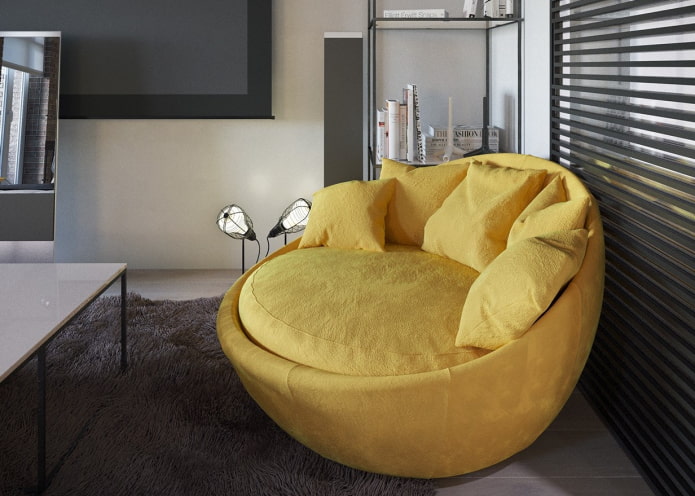 овальный диван желтого цвета в интерьере