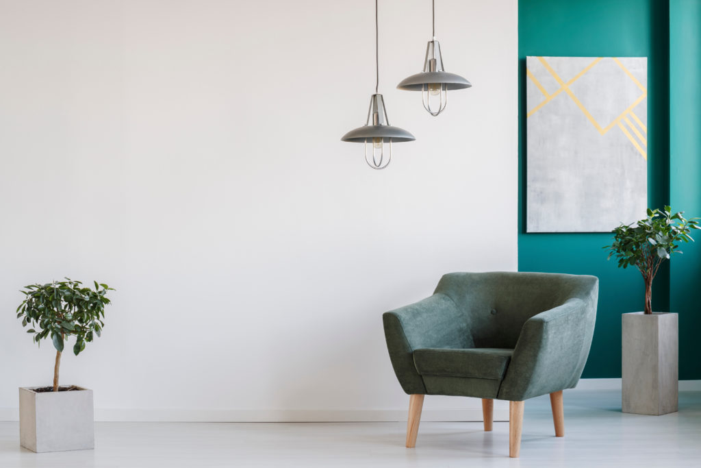 Teal accent wall highlights this modern and minimalistic feel