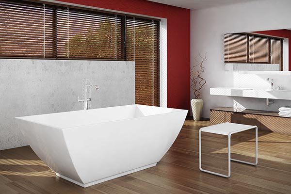 Americh ROC solid stone freestanding tub installed in bathroom